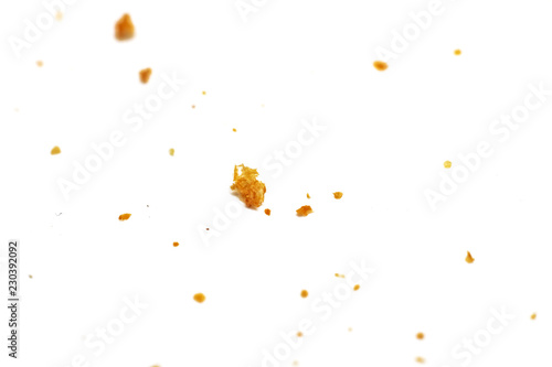White bread crumbs on a white background close up