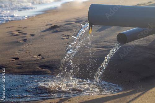 pipe, throwing waste into the sea