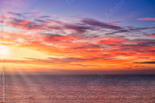 Fototapeta Naklejka Na Ścianę i Meble -  Dramatic Sunrise with Sun Rays over the Sea