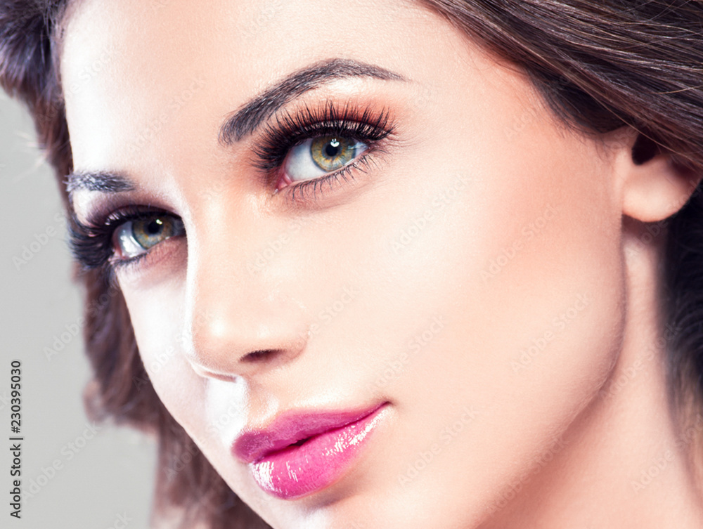 Beautiful eyes lips woman face closeup with healthy skin and beauty maakeup Beautiful eyes lips woman face closeup with healthy skin and beauty maakeup