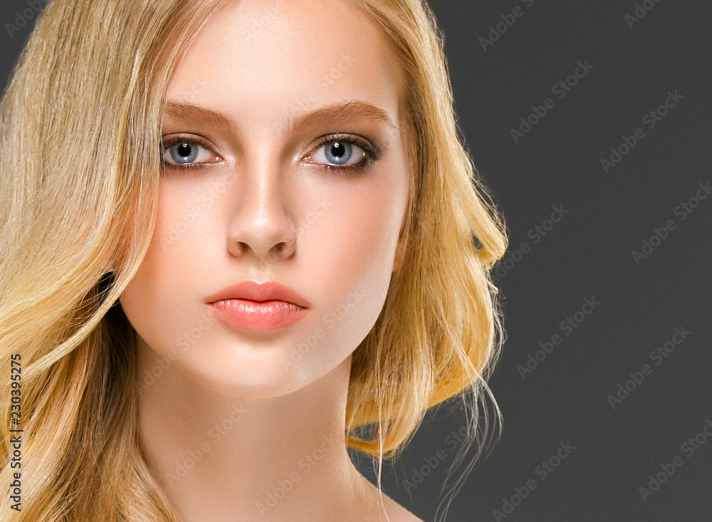 Blonde woman face closeup with healthy skin and beauty makeup Blonde woman face closeup with healthy skin and beauty makeup