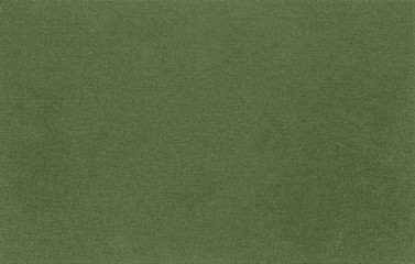 Abstract green fabric the texture. Natural background of rustic linen khaki. The material structure is clearly visible.