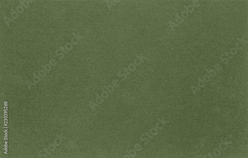 Abstract green fabric the texture. Natural background of rustic linen khaki. The material structure is clearly visible.