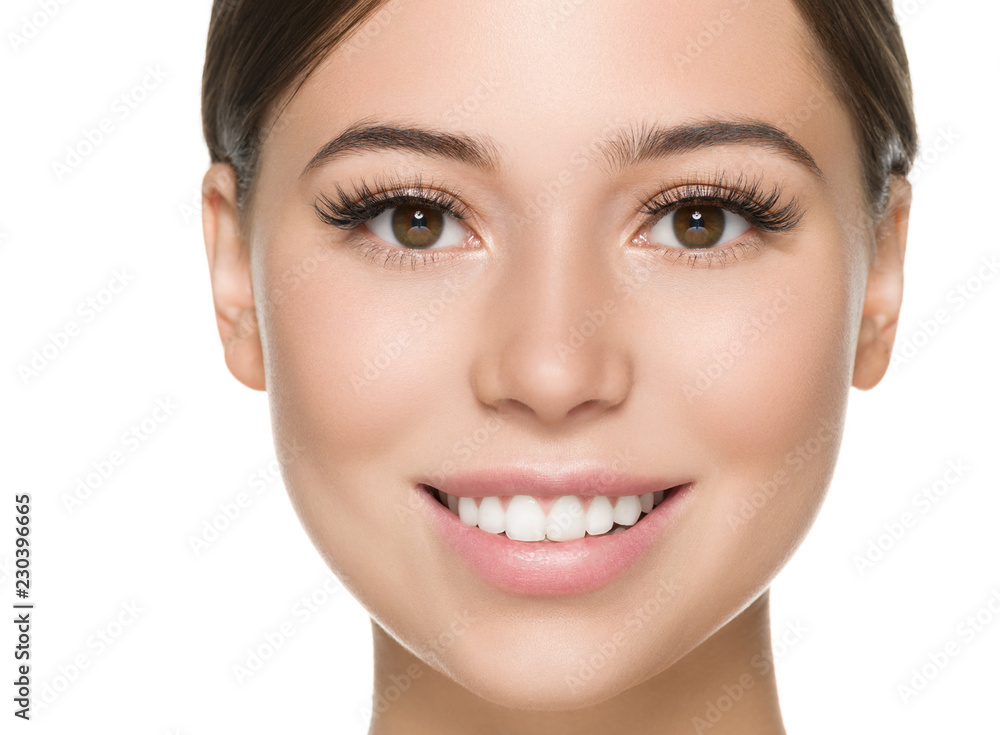 Beautiful woman face close up healthy skin and beauty lashes soft lips isolated on white Beautiful woman face close up healthy skin and beauty lashes soft lips isolated on white