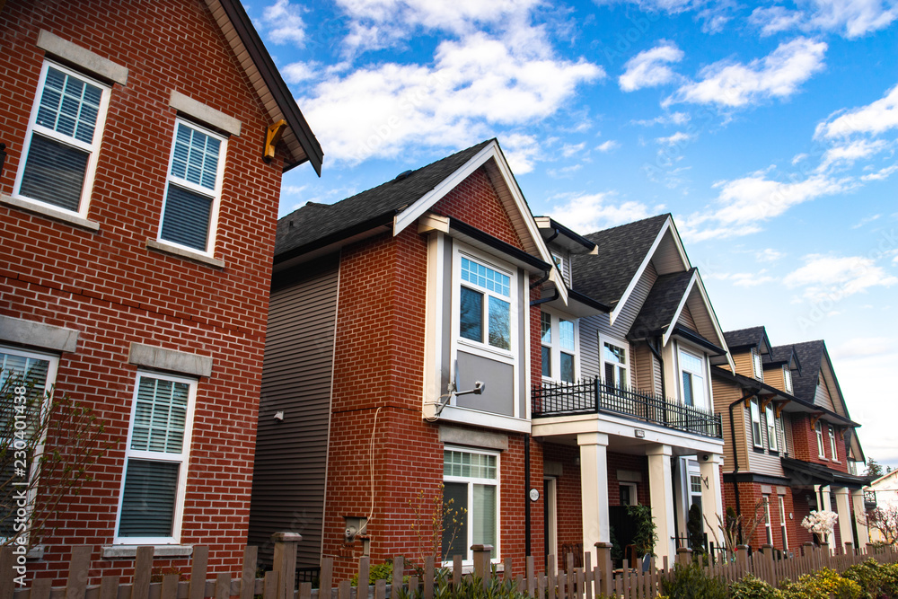 Row of Typical English Terraced Houses. Red brick homes side by side.