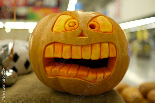 Beautiful original carved Halloween pumpkin with big teeth