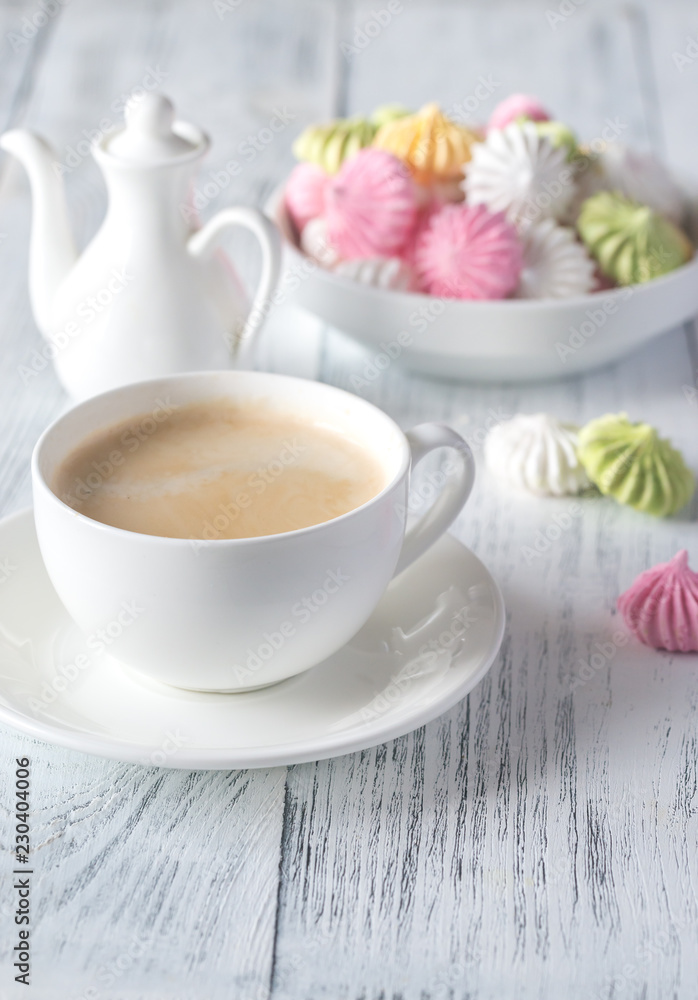 Cup of coffee with colored meringues Cup of coffee with colored meringues