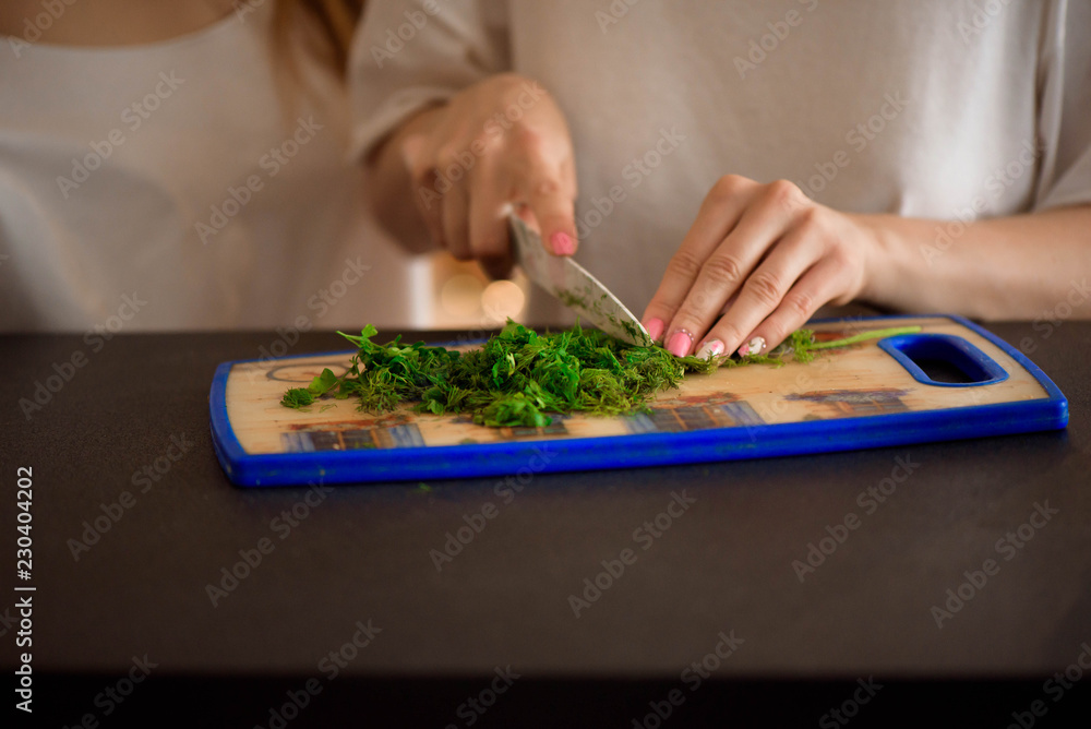 Young sisters making vegetable salad at home Young sisters making vegetable salad at home