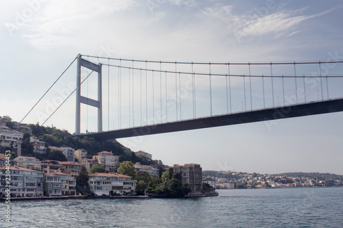 View of FSM bridge, Bosphorus and buildings on European side of Istanbul. It is a sunny summer day.