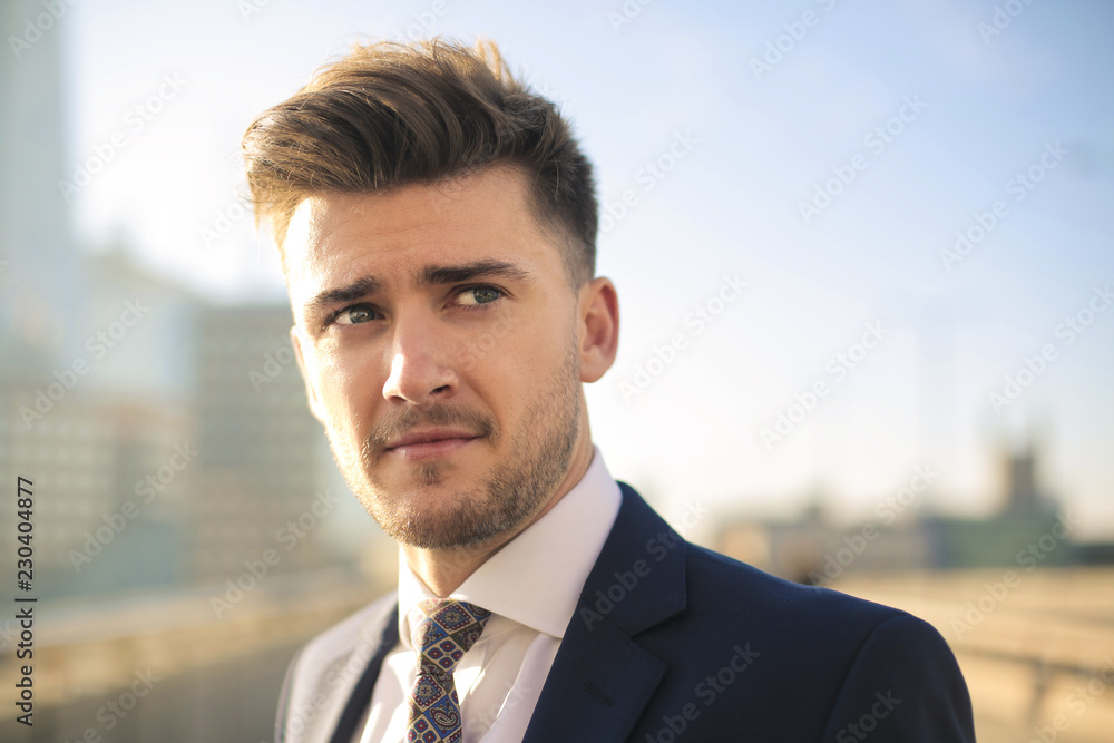 Portrait of a handsome businessman standing in the street Portrait of a handsome businessman standing in the street