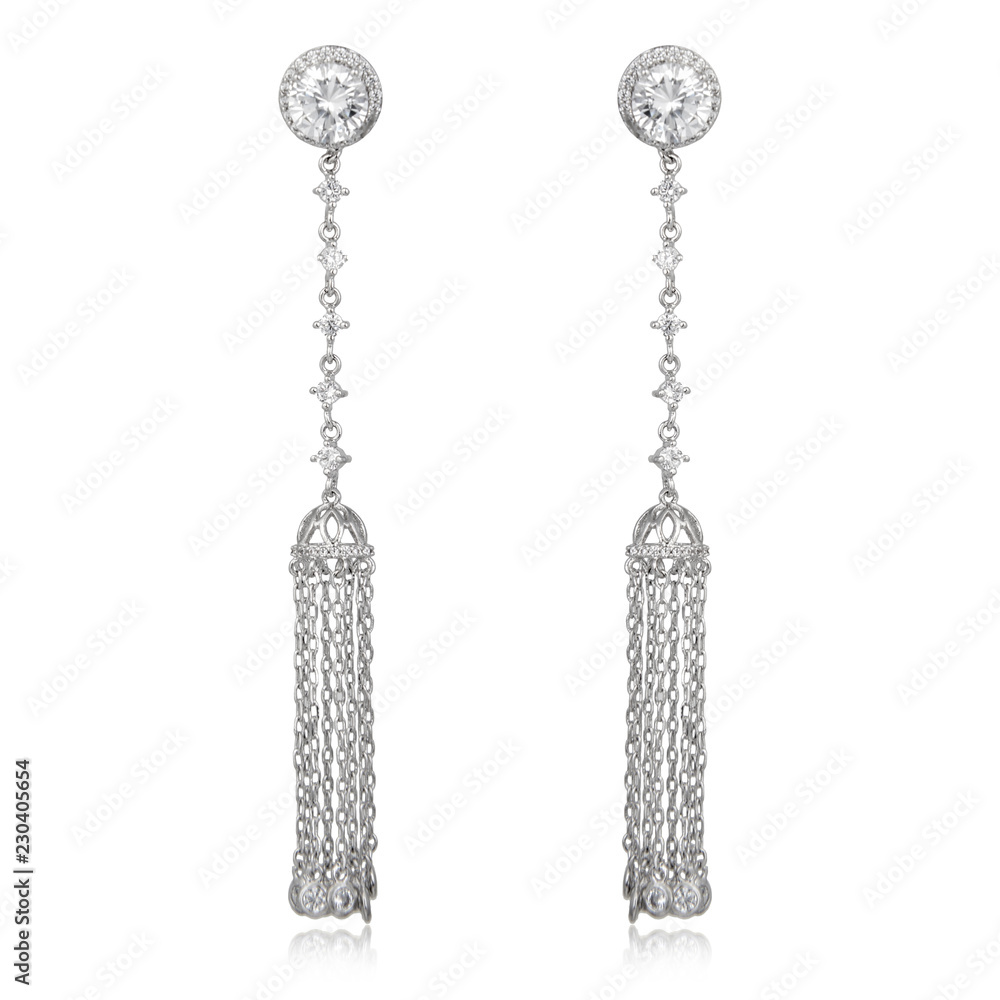 Pair of silver diamond earrings isolated on white Pair of silver diamond earrings isolated on white