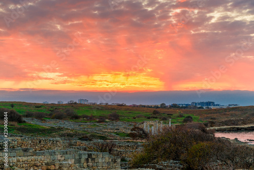 Sunset, beautiful orange sky over Ancient Chersonesos in Crimea, Russia