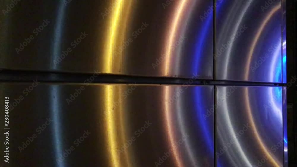 Lights pulsate across a wall Stock Video Adobe Stock