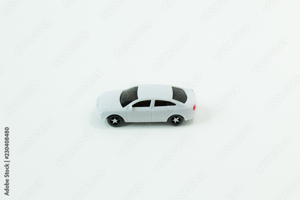 white car toy on white background image close up. white car toy on white background image close up.