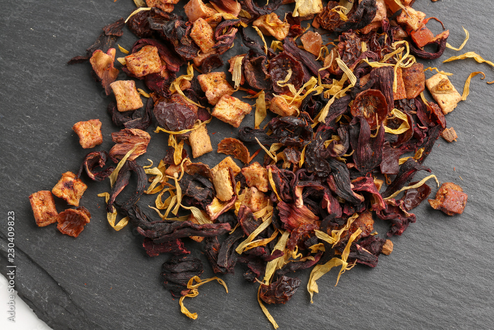 Still life, aromatic dry tea with fruits and petals Still life, aromatic dry tea with fruits and petals