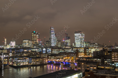 Colorful Business Center Cityscape With View Of River Thames In London, UK At Night.