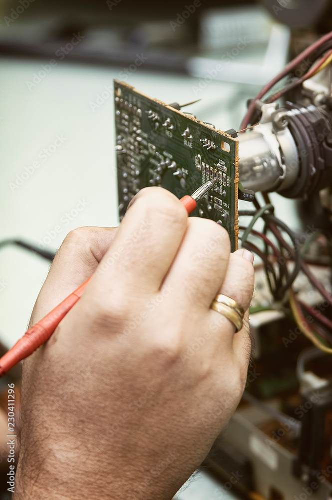 Fototapeta premium Fixing The Components Of A Tube Television