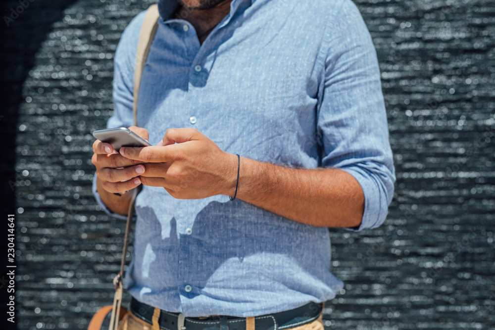 Fototapeta premium Businessman Typing on Samrtphone