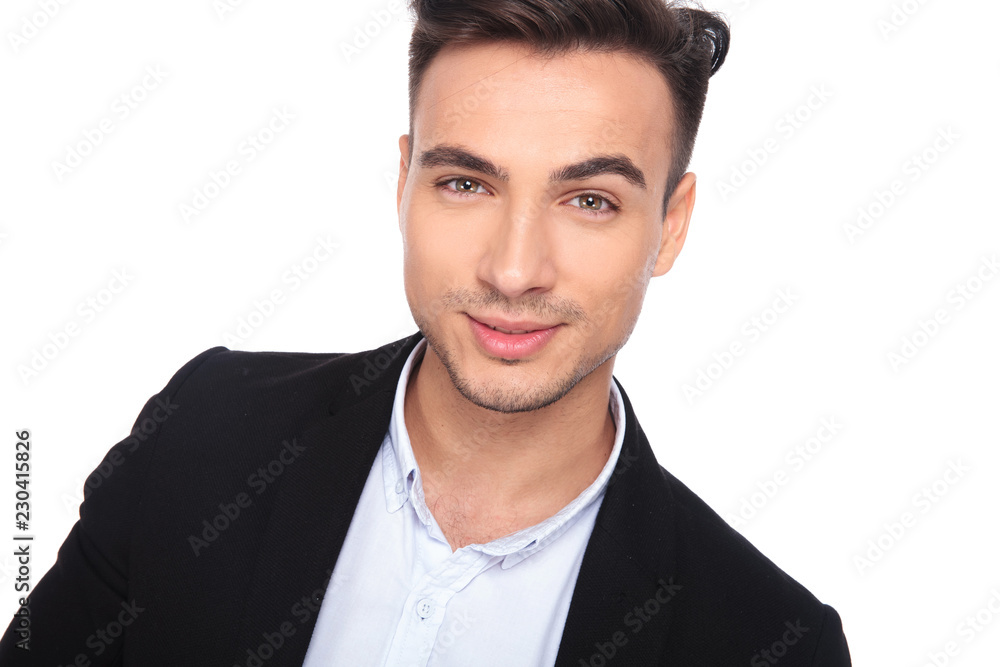 portrait of young smart casual man in black suit smiling portrait of young smart casual man in black suit smiling