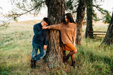 photo shoot of a beautiful brunette and her boyfriend in nature