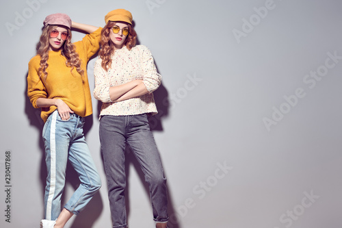 Two Girls Fooling Around. Fashion Autumn Outfit