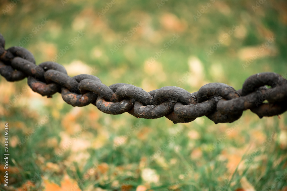 The old rusty black metal chain The old rusty black metal chain