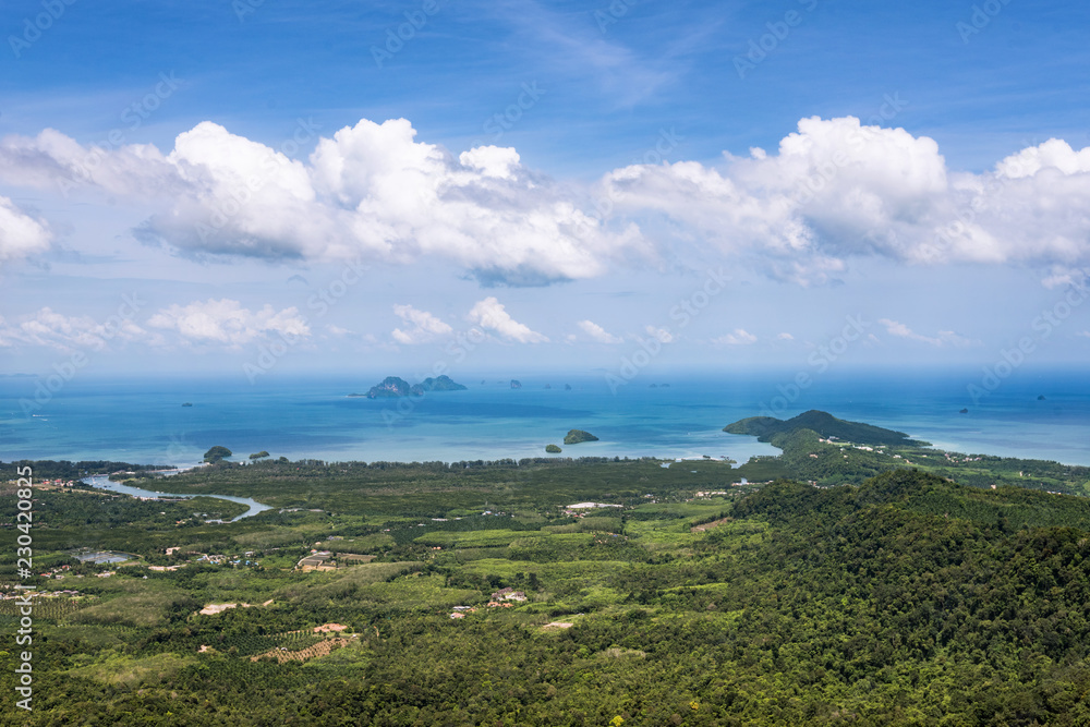 forest and sea view from rough and rocky mountain top