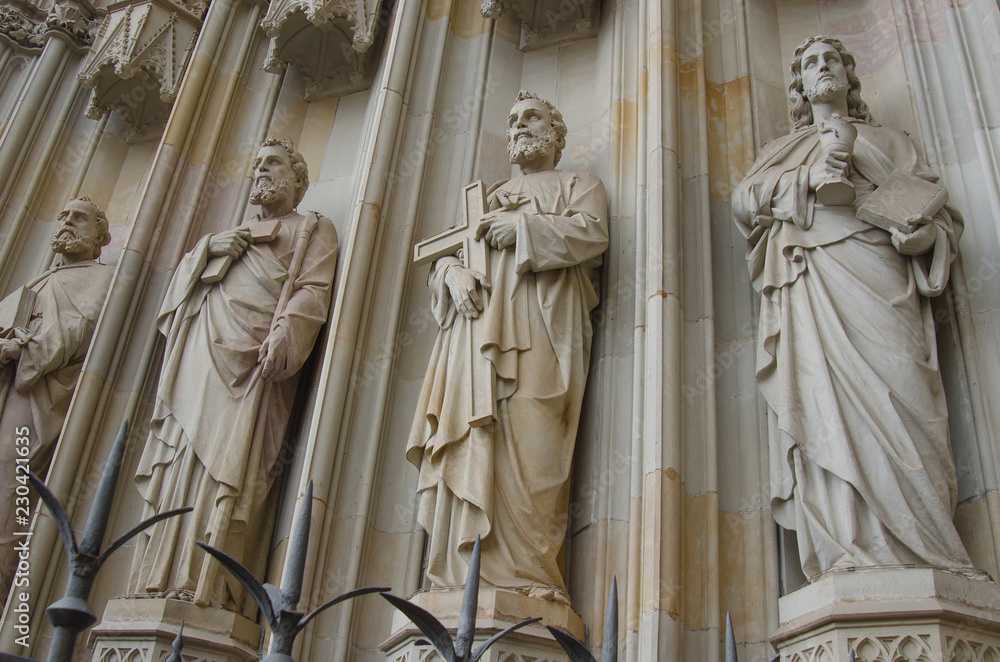 Fototapeta premium Sculptures on the facade of Barcelona Cathedral, located in Gothic Quarter in rainy morning