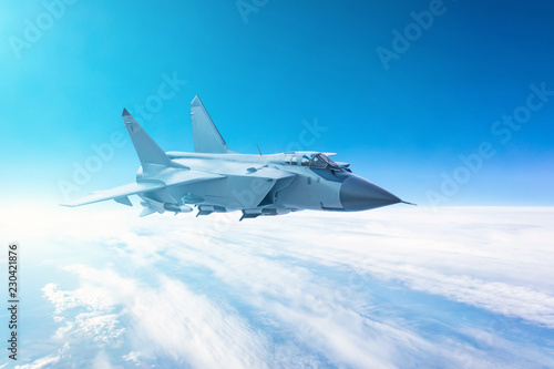 Fighter jet flying with a blue sky background.