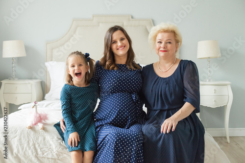 Grandmother, adult daughter and little granddaughter. Happy family portrait