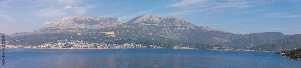 Scenic view of old town, mountains and the coast from water of Kotor bay in Montenegro