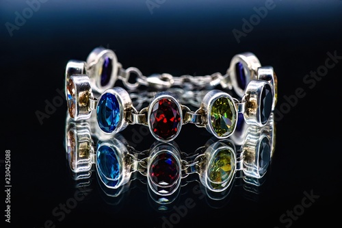 Silver bracelet with color jems Jewelry isolated  photo