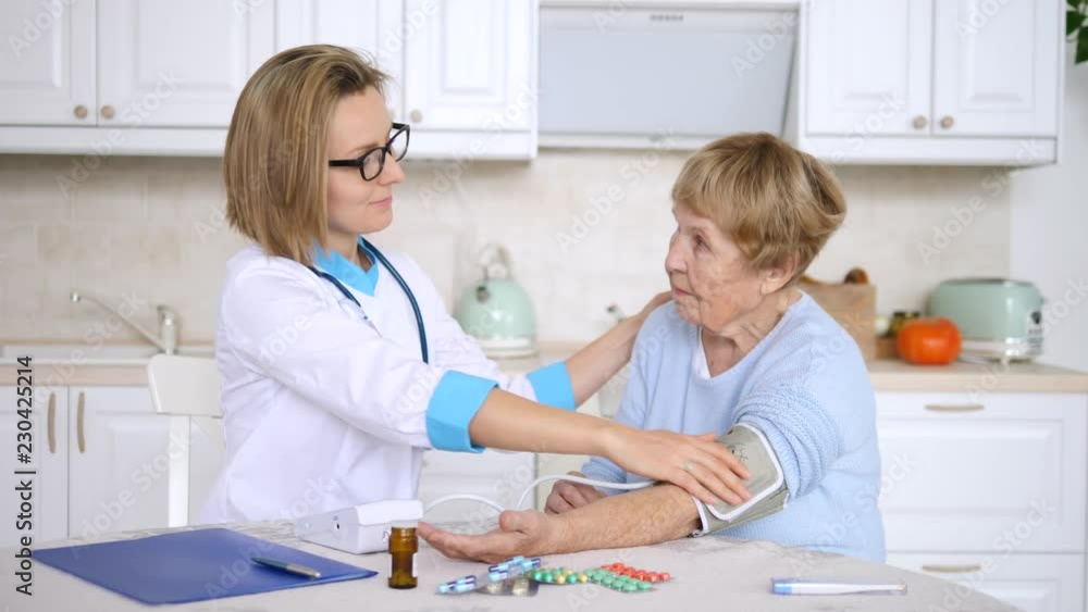 Doctor Measuring Blood Pressure Of Senior Patient. House-Call. Doctor Measuring Blood Pressure Of Senior Patient. House-Call.