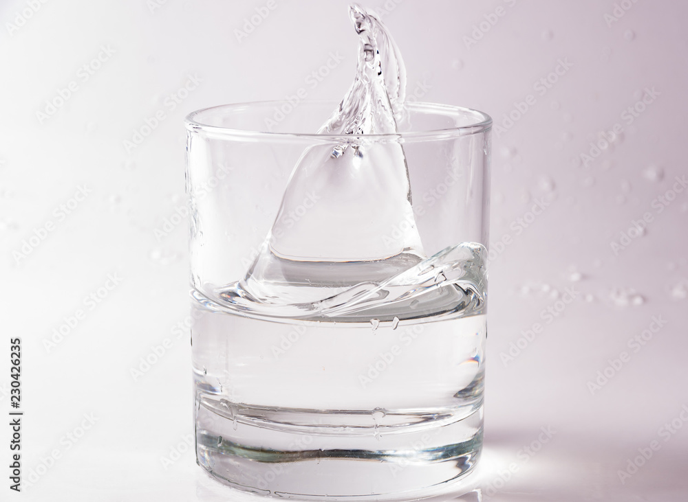 Glasses of water falling and jumping with splashes and drops Glasses of water falling and jumping with splashes and drops