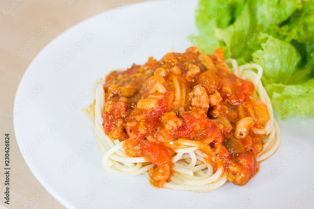 Delicious spaghetti with vegetable served on a white plate, food concept.