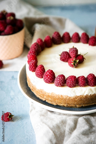 Cake with raspberries and curd cheese. Homemade cream and berry cheesecake