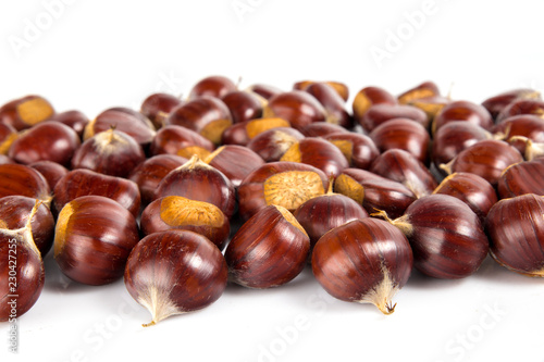Fresh chestnuts with peeled roasted chestnut isolated on white background. Hippocastanum isolated.