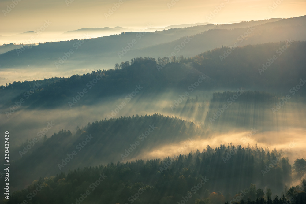 Sunrise in Rudawy Janowickie at foggy morning, Silesia, Poland
