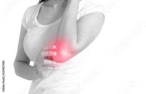 Woman suffering from elbow pain on white background, Black and white toned, Healthcare concept.