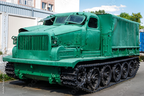 green armored tracked military tractor