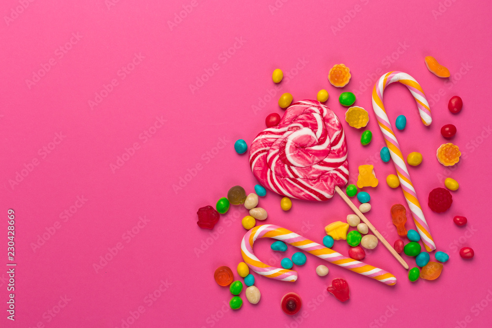 Colorful lollipops on a pink background Colorful lollipops on a pink background