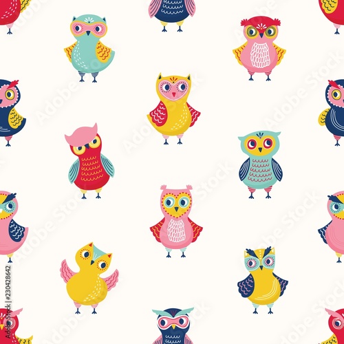 Childish seamless pattern with cute wise owls on white background. Backdrop with cartoon forest birds in different postures. Colorful flat vector illustration for wrapping paper, textile print.