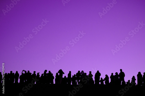 Group People Silhouette on purple background with space can used for design.