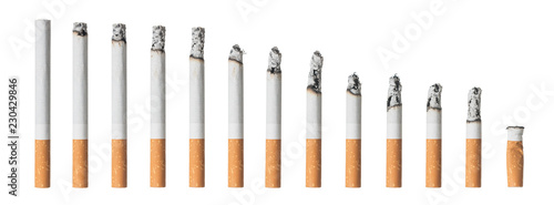 Many different stages of smoked cigarette isolated on white background photo