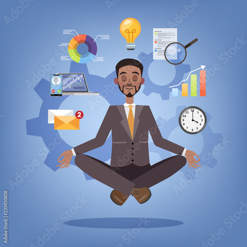 Businessman in lotus pose having break at work