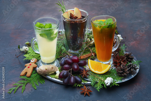 Christmas holiday hot drinks - concept of festive bar menu. Sea buckthorn, grape and ginger tea.