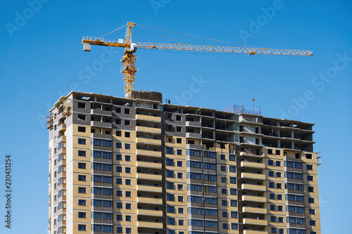 Crane and building construction site