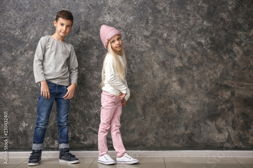 Cute boy and girl in fashio...
