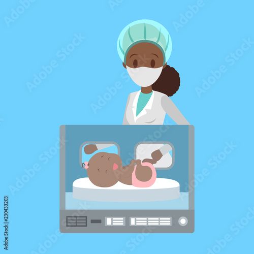 Newborn child in the hospital incubator box