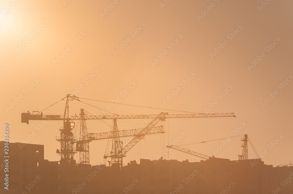 Building construction site and cranes Building construction site and cranes